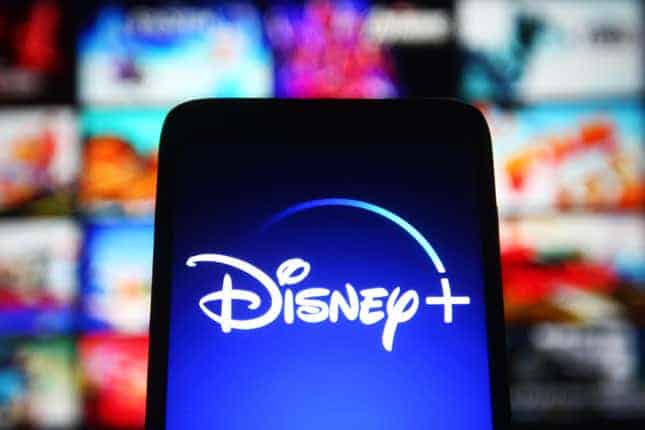 business new tamfitronics Disney+ logo on cellular phone video display