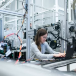 photo of female engineer working on her workspace