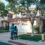 couple standing in front of their house