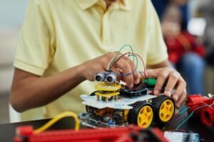 boy playing with an electronic toy car