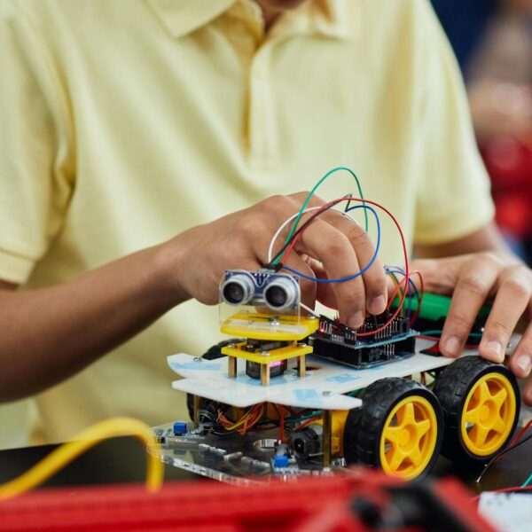 boy playing with an electronic toy car