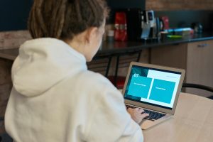 photo of woman using laptop