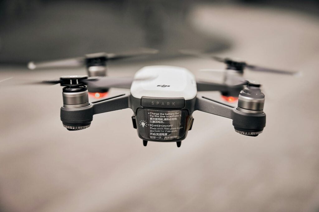 flying white drone tilt shift lens photography