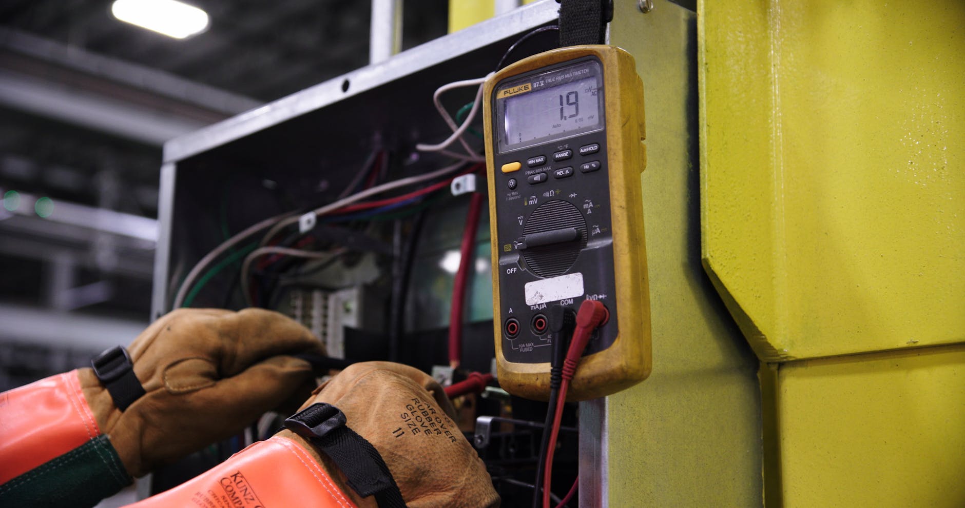 man fixing electric box