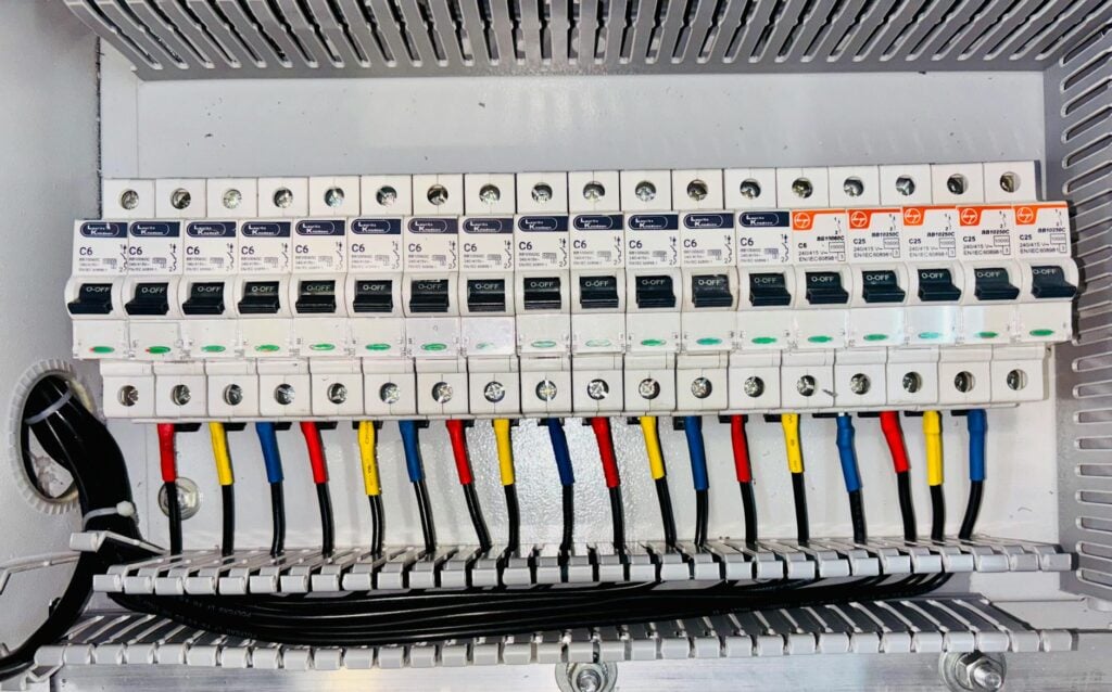 electrical circuit breaker panel with color coded wiring