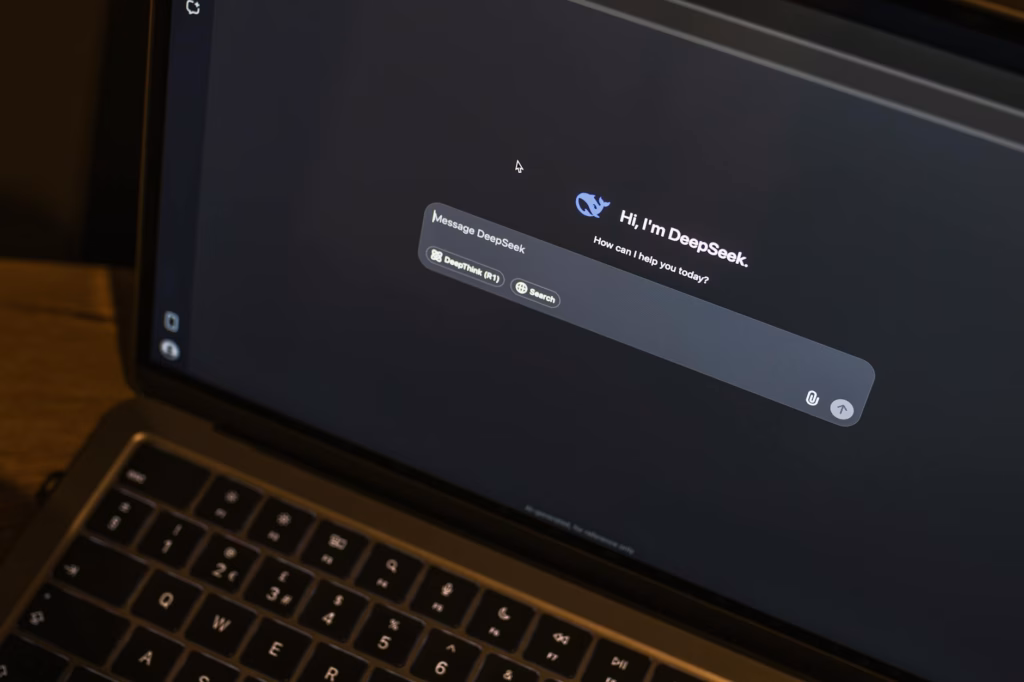 laptop displaying ai chat interface at night