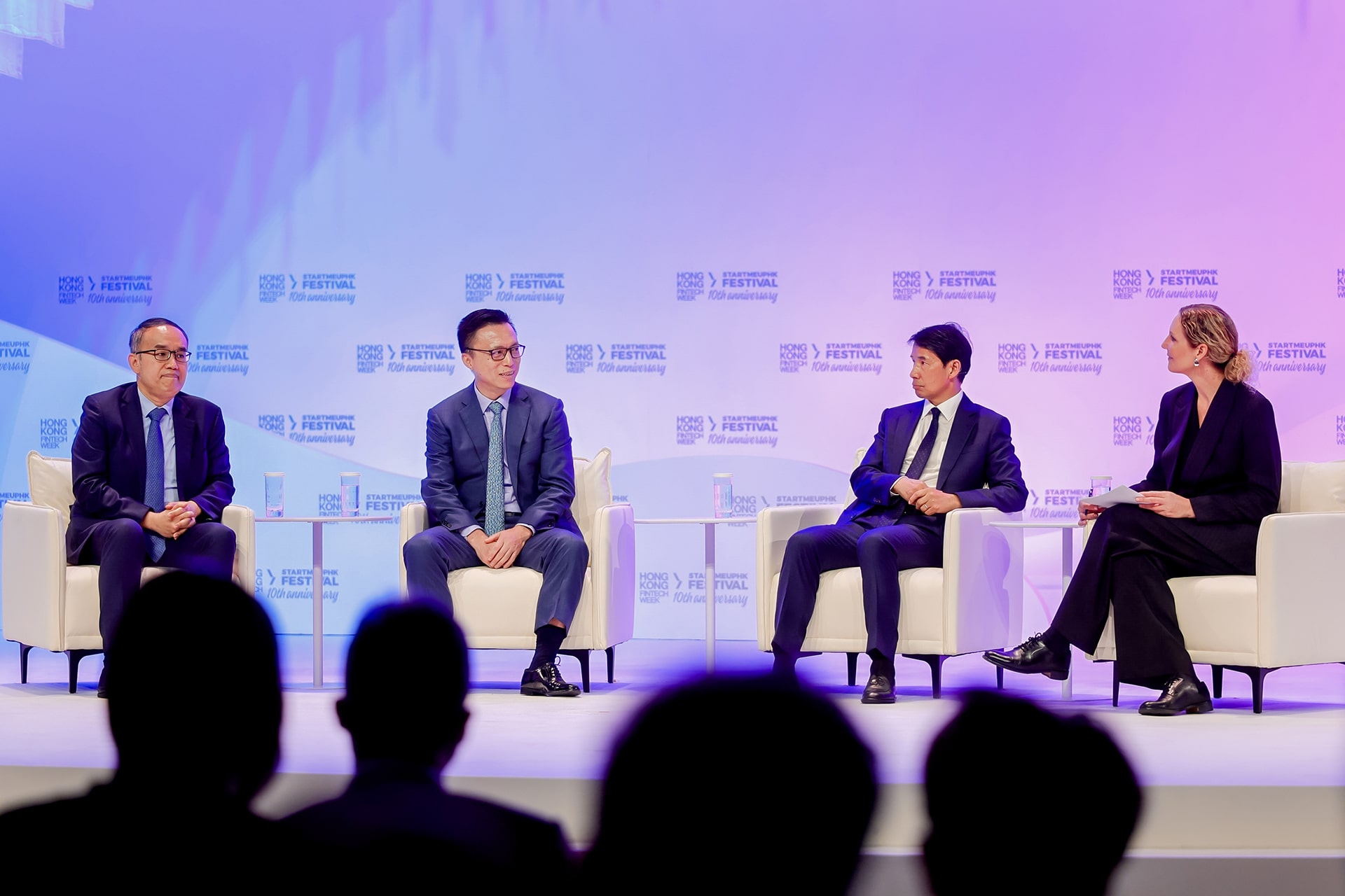 business Photo of Ant Group chairman Eric Jing (second from left) speaking during a panel discussion at Hong Kong Fintech Week 2025, alongside Christopher Hui (first from left), Hong Kong’s secretary for financial services and the treasury; Fred Hu (second from right), founder, chairman, and CEO of Primavera Capital Group; and moderator Drew Propson, head of technology and innovation in financial services at the World Economic Forum.