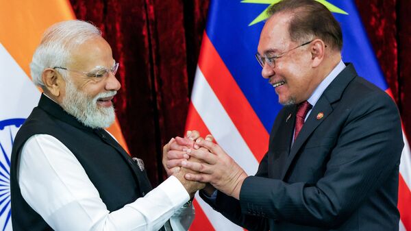 Prime Minister Narendra Modi with Malaysia's PM Anwar Ibrahim during their joint press statement, in Kuala Lumpur on 8 February. The two countries announced a host of cooperation and collaboration measures.