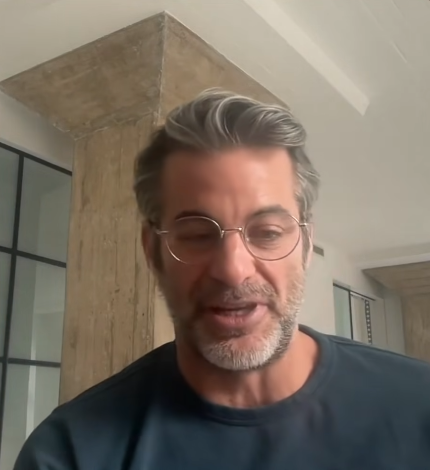 Jim Curtis with gray hair and glasses.