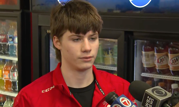 teen hockey player speaks to reporters